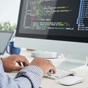 Man coding on his computer