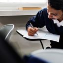 Young man having a written exam