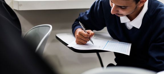 Young man having a written exam